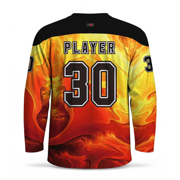 Custom long-sleeve hockey jersey shown from the back, featuring a fiery orange and yellow flame pattern, black shoulder yoke, and personalized name and number printed in black and white on the back.