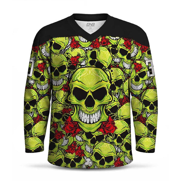 A long-sleeve V-neck jersey with a black shoulder yoke and an all-over graphic print of lime green skulls, black skulls, white teeth, and red roses. personalized number is visible on the sleeve.