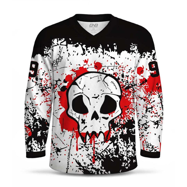 A long-sleeve V-neck hockey jersey with a black, white, and red graphic design. The center features a large white skull with black details and dripping red blood, surrounded by red splatters and black splatter patterns on a white background.