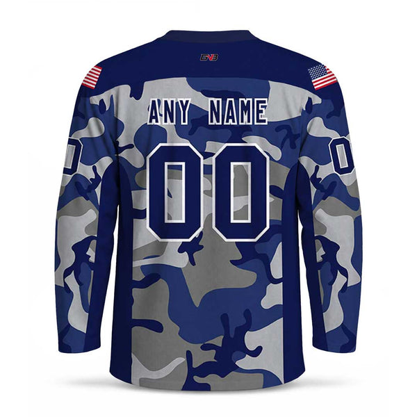 Custom long-sleeve jersey shown from the back with a blue, gray, and navy camouflage pattern. The back features personalized name and number, with small American flag patches on the shoulders.