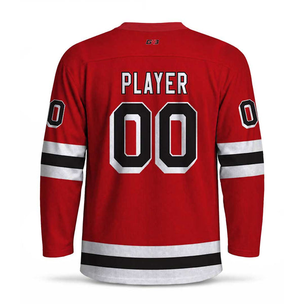 A red hockey jersey shown from the back, featuring personalized name and number in white and black block lettering. The sleeves have black and white stripes.