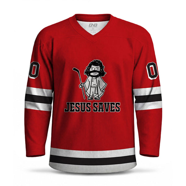 A red long-sleeve hockey jersey with a V-neck, black and white sleeve stripes, and a front graphic of a cartoon bearded figure holding a hockey stick above the text 'JESUS SAVES'. The jersey is shown on a plain white background.