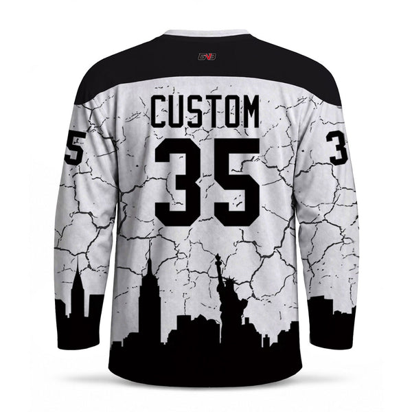 Custom long-sleeve hockey jersey shown from the back, featuring a black and white lighting design with a black city skyline silhouette and personalized name and number on a white background.