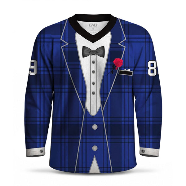 A long-sleeve V-neck hockey jersey styled like a tuxedo jacket, featuring a royal blue and navy plaid pattern, a white shirt graphic, a black bow tie, a red rose boutonniere, and personalized number on both sleeves.
