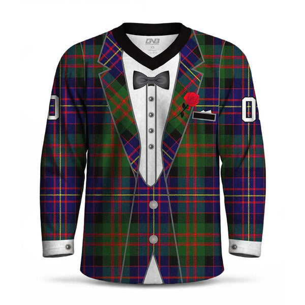 A long-sleeve V-neck hockey jersey featuring a printed tuxedo jacket design over a green, red, and blue tartan plaid pattern. The shirt includes a black collar, a white shirt graphic, a black bow tie, a red rose lapel pin, and white cuff details.