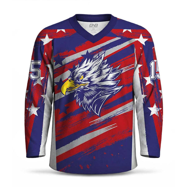 A long-sleeve hockey jersey with a patriotic red, white, and blue design featuring diagonal stripes, white stars, and a large white eagle graphic on the chest. The jersey has a V-neck, ribbed cuffs, and the number 15 printed on the sleeves.