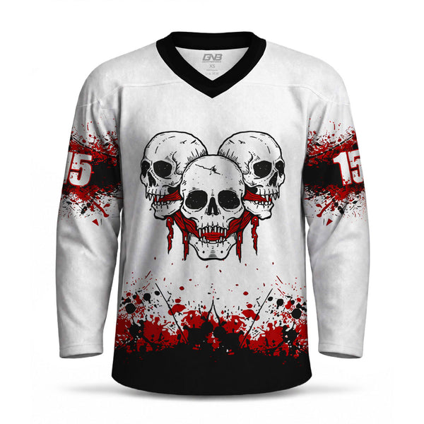 A white long-sleeve hockey jersey with a black V-neck collar, featuring a graphic of three skulls with red blood dripping from the center skull. The jersey has red and black paint splatter graphics on the sleeves and hem, with personalized number printed on each sleeve.
