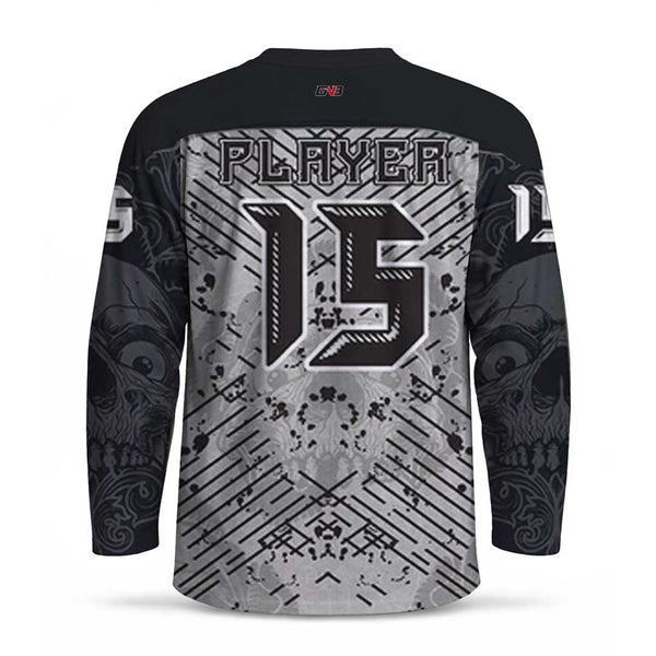 A long-sleeve hockey jersey shown from the back, featuring a black collar and sleeves, a gray and black distressed graphic design with diagonal lines and splatter details, and personalized name and number