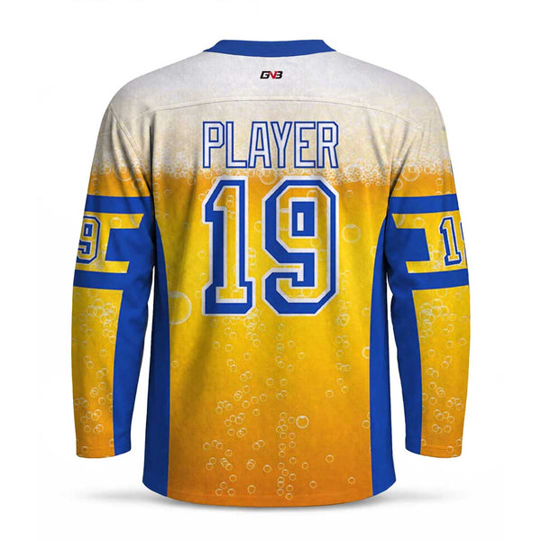 Long-sleeve sports jersey shown from the back with personalized name and number. The jersey has a white-to-yellow beer-bubble gradient with blue side panels and sleeve stripes.