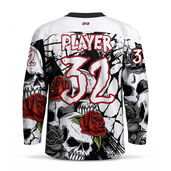A long-sleeve hockey jersey shown from the back, featuring a white base with a black and gray skull and rose graphic print, large red and white number on the back, and personalized name above it. 