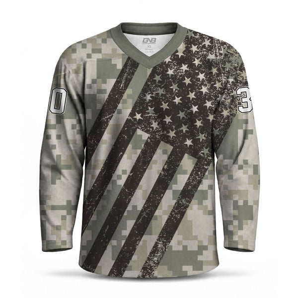 A long-sleeve V-neck hockey jersey with a distressed American flag design overlaid on a digital camouflage pattern. 